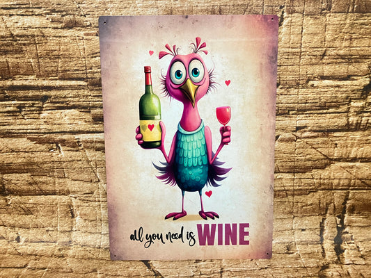  Humoristisch bord met een cartoonvogel met roze veren en een wijnfles en wijnglas in de vleugels, omringd door rode hartjes, met de tekst “all you need is WINE” op een rustieke houten achtergrond.