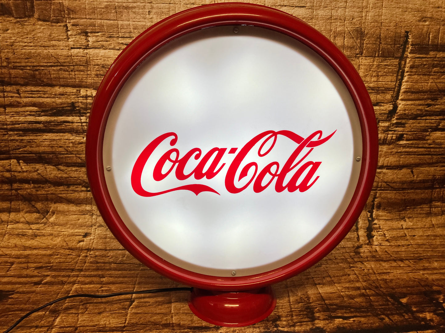 Lichtreclame met Coca Cola opdruk.