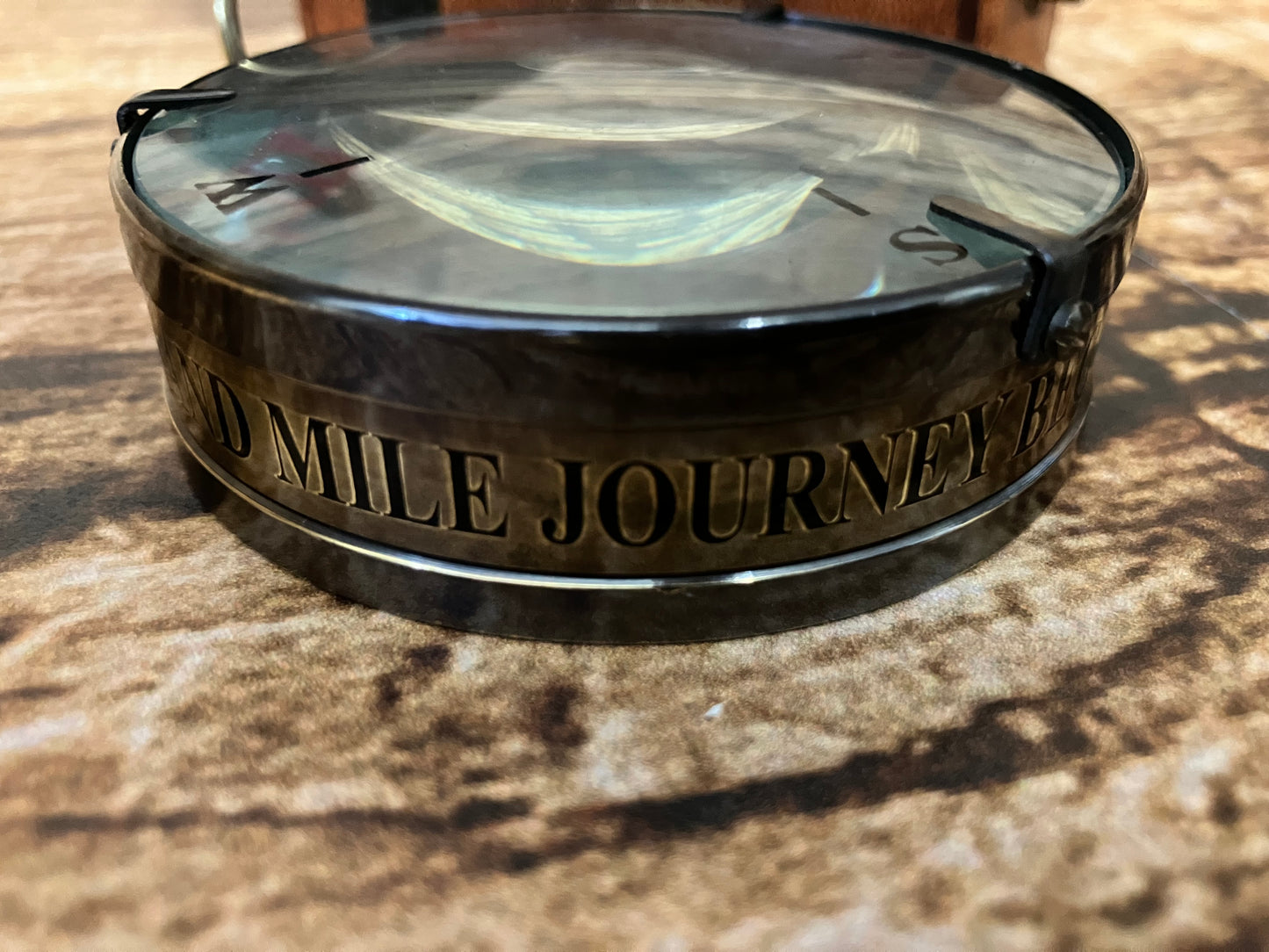 Kompas in lederen etui.