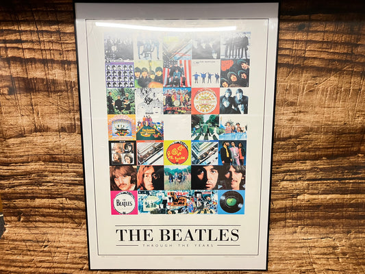The Beatles poster in lijst.