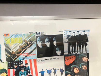 The Beatles poster in lijst.