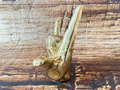 Gouden handbeeldje "I Love You" / "Rock On"
